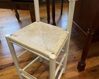 $125; Four painted counter-height rush seat bar chairs; approx. 24" seat, 38" back x 18" W. x 14 D.; wear from use