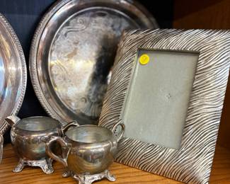 Beautiful silver trays, cream and sugar sets and frames