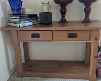 Entrance way desk candles, books,
Vases