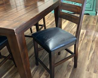 counter-height dining table and four chairs