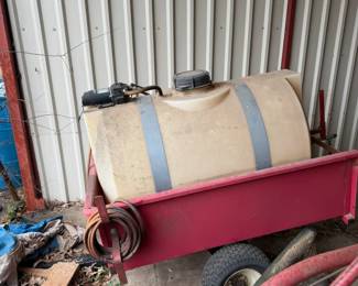 Chemical sprayer and red wagon