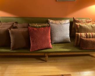 Fantastic 70's wooden frame sofa. Lots of pillows too!