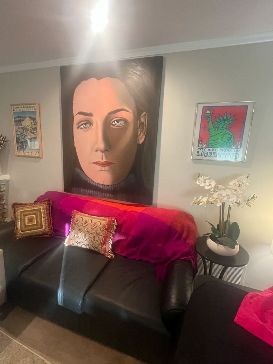 PICTURED IS BLACK LEATHER HIDE-A-BED COUCH WITH SOME WEAR ASKING $100.00 OBO. ORIGINAL LARGE CANVAS IS APPROX. 7' X 5' AND @ MORE THAN 50% OFF IT'S ONLY $500.00. FRAMED ART ON RIGHT SIDE IS NOT AVAILABLE.