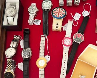 EVERYTHING FROM "LONDON FUN" A "MAO" DICTATOR WATCH TO PORCELAIN WHITE HIGH-END "CHANEL J-12."  SOME WATCHES AS LOW AS $10.00, THE CHANEL HOWEVER IS PRICED RESPECTFULLY LOWER BUT NOT 50%. THERE ARE ONLY A FEW THINGS THAT ARE NOT 50% AT OUR SALE.