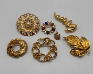 Collection Of Golden Brooches