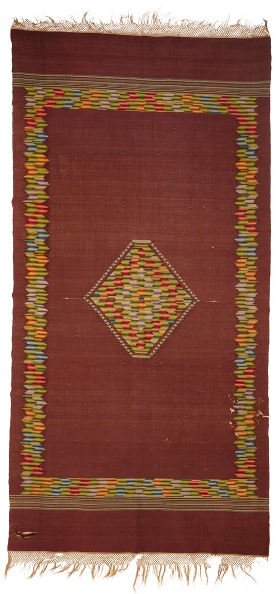 1
A Regional style Mexican Saltillo sarape textile
Late 19th/early 20th century, Transitional period, 1875-1910; San Luis Potosi
Woven with wool weft on cotton warp in a single width with variegated multicolored yarns on a brown field with multicolored border and central diamond
78.5" H x 39" W; fringe: 5" approximately
Estimate: $600 - $800