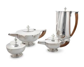 141
A Mexican sterling silver coffee and tea service
Circa 1940s
Each marked to underside: Jiménez / Sterling / 925 / [Eagle 1]
Comprising:
Coffee pot (10.125" H x 6' W x 4" D)
Teapot (5.5" H x 10.625" W x 6.625" D')
Covered sugar (4.125" H x 4' Dia.)
Cream jug (4.25" H x 7.875" W x 4" D)
Total weight: 73.1 gross oz. troy approximately
Estimate: $2,500 - $3,500