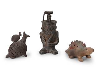 139
Three Pre-Columbian style pottery figures
20th century
Comprising a barro negro figural vessel, possibly a censer, a barro negro mammalian figure, and a polychrome dinosaur
3 pieces
Tallest: 8.625" H x 4.25" W x 3.625" D; Dinosaur: 3.375" H x 8" W x 3.375" D
Estimate: $200 - $400