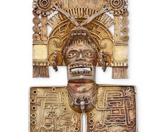 131
A Mexican silver Pre-Columbian style pendant/brooch
Mid/late 20th century
Stamped: FV / Mexico / Sterling / 925
A large vermeil sterling silver pendant brooch depicting a masked figure with an elaborate headdress
3" H x 2.125" W
39.1 grams gross
Estimate: $200 - $400