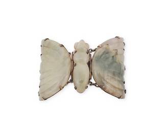 196
A Mexican silver and hardstone butterfly bracelet
Mid-20th century
Stamped: Silver / Mexico
A chunky sterling silver chain link bracelet featuring a central three-piece carved greenstone butterfly and dark green cabochon clasp
6.5" to 7" L x 2.325" H
106.0 grams gross
Estimate: $300 - $500