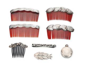 208
A group of Mexican silver hair and dress accessories
Mid-20th century
Four variously marked: Silver / Mexico
Six works comprising two pairs of silver hair combs, one in leaf motifs, a smaller silver swirl comb, and a silver leaf hair clip barrette, as well as an arabesque motif silver tie clip and a diminutive sterling silver scent bottle with amethyst cabochon finial
8 pieces
Largest: 1.75" H x 4" W; Smallest: 0.875" H x 2.125" W
75.1 grams gross
Estimate: $200 - $400