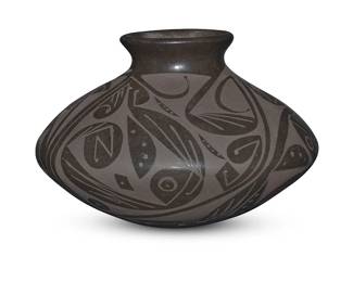 182
Two Mata Ortiz blackware pottery jars
Two works:

Octavia Andrew (b. 1970, Mexican)
A flat-shouldered low jar, late 20th/early 21st century
Incised to underside: Octavio Andrew
With black on black feather and parrot motifs
3.75" H x 5.875" Dia.

Ruben Lozano Lucero (20th/21st century, Mexican)
A low pottery jar, late 20th/early 21st century
Incised to underside: R Lucero
With black on black foliate motifs
4.25" H x 5.875" Dia.

2 pieces
Estimate: $100 - $200