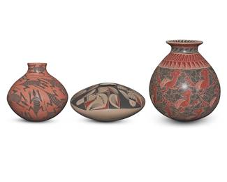 184
Three Mata Ortiz pottery vessels
Three works:

Eleuterio Pina (20th/21st century, Mexican)
A polychrome sgraffito pottery jar, late 20th/early 21st century
Incised to underside: Eleuterio Pina A
Decorated in red and black on cream, with banded geometric motifs to rim and shoulder, the body depicting repeated bird motifs
7" H x 6" Dia.

Jose Villa (20th/21st century, Mexican)
A redware pottery jar, late 20th/early 21st century
Incised to underside: Jose Villa
With black lizards on red slip ground
4.625" H x 5" Dia.

Jesus Martinez (b. 20th century, Mexican)
A polychrome pottery seed jar, late 20th/early 21st century
Incised to underside: Jesus Martinez
With red and black feather and geometric motifs to wide shoulder on a cream slip ground
3.375" H x 7.25" Dia.

3 pieces
Estimate: $200 - $400