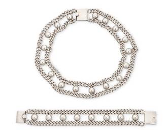201
A set of Mexican sterling silver jewelry
Mid/late 20th century
Each stamped: FARFAN / 925 / Hecho en Mexico / [necklace mark obscured]
Comprising a wide double chain-and-ball choker necklace, together with a matching bracelet
2 pieces
Necklace: 15.75" L x 1" H; Bracelet: 7.75" L x 1" H
154 grams
Estimate: $200 - $400