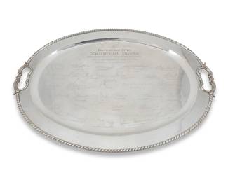 37
A Mexican sterling silver tray signed by ambassadors
1971
Marked to underside: MAP / 925 / Sterling / Hecho en Mexico; further marked: [Eagle 61]; inscribed: Al Excelentisimo Señor / Nathaniel Davis / Embajador de los Estados Unidos de America con la Estimacion de sus Colegas / Guatemala 19 de Agosto de 1971
Engraved with signatures of various ambassadors to Latin America, with opposed handles
23" W x 16.5" D
65.6 oz. troy approximately
Estimate: $1,200 - $1,800