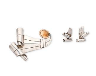 205
A group of William Spratling Mexican silver jewelry
William Spratling (1900-1967)
Circa 1944-1946, First Design Period; Taxco, Mexico
Each stamped for William Spratling; further variously stamped: Spratling Silver / Made in Mexico
Comprising a sterling silver swirl ribbon brooch with copper circle accent, together with a pair of matching sterling silver ribbon band screw-post earrings
3 pieces
Brooch: 3" H x 3" W; Earrings: 1.25" H
61.5 grams gross
Estimate: $400 - $600