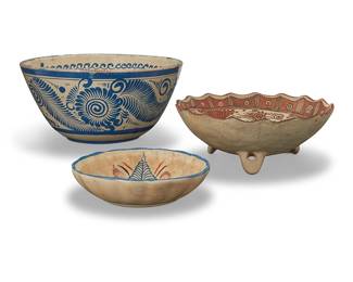 92
Three Tonalá pottery bowls
Mid-20th century; Jalisco, Mexico
One twice impressed to underside: MEXICO
Comprising one larger bowl with blue foliate motifs, one footed bowl decorated with bird motifs, and a small bowl with scalloped rim and foliate decoration
3 pieces
Largest: 6.75" H x 13.75" Dia.; Smallest: 2.125" H x 8.5" Dia.
Estimate: $200 - $300