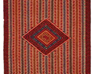 6
A Mexican Saltillo sarape textile
Late 19th century, post-Classic period, 1850-1875
Woven with wool weft on cotton warp in two panels seamed down the middle, with multicolored vertical serrated columns and a concentric-style diamond to center
83" H x 51" W
Estimate: $2,000 - $3,000