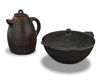 91
Two Latin American pottery cookware vessels
20th century
Comprising a tall lidded teapot vessel with handle, with brownish glaze and scattered faint black motifs to body and black interior, together with a wide burnished black pottery lidded dish, the bowl with integral handles with mask motifs, and the lid with a rounded finial
2 pieces
Teapot: 9.75" H x 8.5" W x 7" D; Dish: 7" H x 13" W x 11" D
Estimate: $100 - $200