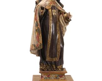75
A Spanish Colonial polychrome carved wood figure of St. Theresa of Avila
19th century
The figure and base with gilt and painted decorations
Figure: 21.25" H x 9.5" W x 11.25" D; Overall: 27.25" H x 10.25" W x 11.25" D
Estimate: $600 - $800
