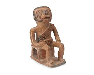 133
A Pre-Columbian Capulí pottery coquero figure
Circa 900 CE; Narino-Carchi, Colombia/Ecuador
The ceramic figure of a male dignitary chewing coca-leaf, depicted seated on a stool and adorned with face paint and a diagonal sash with geometric motifs
7" H x 4.125" W x 4.375" D
Estimate: $300 - $500
