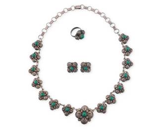 198
A set of Mexican silver and hardstone jewelry
Mid/late 20th century
Each variously marked: Mexico / Sterling / Silver
Comprising a sterling silver necklace with large central quatrefoil floral link suspended by fourteen smaller links either side, each with set green stone cabochon, together with a matching ring and pair of earrings
4 pieces
Necklace: 19.5" L x 1.125" H; Earrings: 0.625" H; Ring size: 6
56.6 grams gross
Estimate: $200 - $300