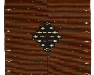 8
A Regional style Mexican Saltillo sarape textile
Early 20th century; Tlaxcala or Puebla
Woven with wool weft on cotton warp in two panels seamed down the middle, featuring a brown banded field with a central stepped diamond, with a bocamanga opening to center
77.75" H x 43" W; fringe: 4.5" approximately; opening: 15.75"
Estimate: $600 - $800