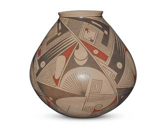 173
Taurina Baca (20th century, Mexican)
A Mata Ortiz polychrome pottery jar, late 20th/early 21st century
Incised to underside: Taurina Baca
The three-color jar with red and black fine-line and geometric motifs on a cream slip ground
10.5" H x 10.5" Dia.
Estimate: $200 - $300