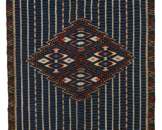 3
A Mexican Saltillo sarape textile
Late 19th century, post-Classic period, 1860-1875; San Miguel de Allende
Woven with wool weft on cotton warp, in two panels seamed down the middle in blue, black, red, purple, light green and cream wool, with an aggregate style diamond center, and with banded ends, and fringing to one end
76" H x 41.5" W; fringe: 4-5" approximately
Estimate: $1,500 - $2,500