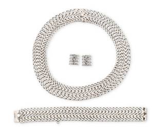 200
A set of Mexican sterling silver jewelry
Mid/late 20th century
Two stamped: FARFAN / 925 / Sterling / Hecho en Mexico / FSZE; [necklace double-struck, obscured]
Comprising a wide herringbone mesh link choker necklace, together with a matching bracelet and a pair of earrings
4 pieces
Necklace: 15.75" L x 0.875" H; Bracelet: 7.5" L x 0.875" H; Earrings: 0.625" H
135.1 grams
Estimate: $200 - $400