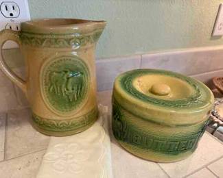 Yellow ware Cow pitcher and Butter crock ( lid has been re-glued and is chipped)