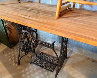 Cast iron Singer sewing machine treadle base with wood top