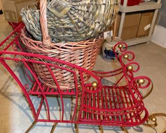 Large metal sleigh with decorative baskets