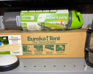 Camping supplies including Eurkea! Tent, Aerobed airbed and pump and Eddie Bauer lantern