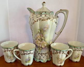 Antique hand-painted Nippon porcelain chocolate pot set with four cups