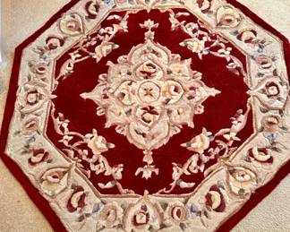 4' (approx.) octagonal red area rug