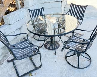 Iron Patio Glass-Top Dining Table and Four Chairs (Two are Swivel Rockers)