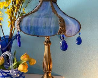 blue Tiffany-style stained glass table lamp with a scalloped shade and hanging blue glass accents