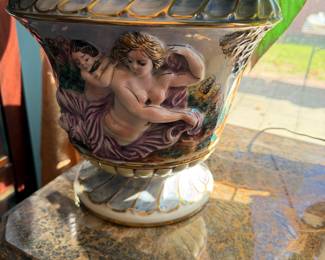 Capodimonte-style ceramic urn or vase featuring raised, hand-painted figures and heavy gold gilt accents