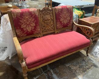 Antique Eastlake Victorian settee with carved wood frame