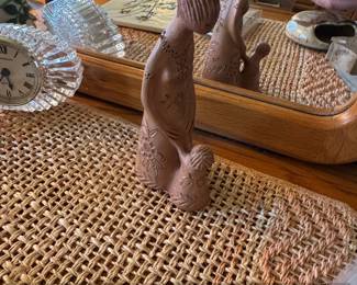 Terracotta Figurine of a Woman Holding a Child with Incised Floral Patterns