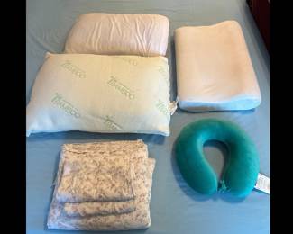 1 Neck pillow, 3 pillows, 1 flat sheet, and 2 pillow cases