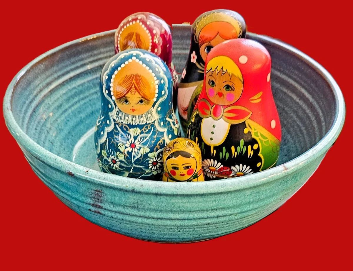 Russian nesting dolls in vintage bowl