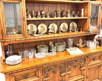 Hummel collection of figurines and plates and country china cabinet