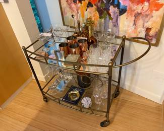 $290. Four Hands bar cart.  40 inches wide by 21 inches deep by 33 inches high.   Accessories available during in person shopping Friday and Saturday.