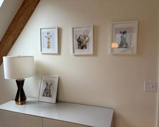 Framed animal prints for sale during in person shopping Friday and Saturday.