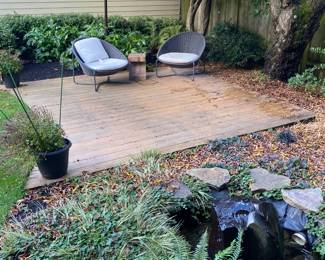 Crate and Barrel Moroccan Graphite outdoor chairs and umbrella for sale during in person shopping Friday and Saturday.