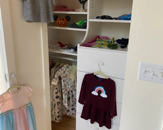 Children's clothing and accessories for sale during in person shopping.