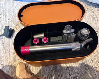 Dyson hair dryer for sale during in person shopping Friday and Saturday.  Missing two curlers.