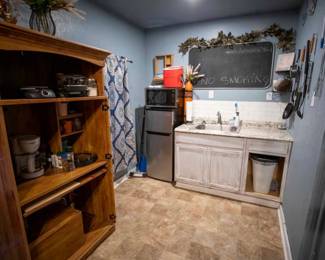 Red Ice maker , microwave , cooking utensils , greenery decor 